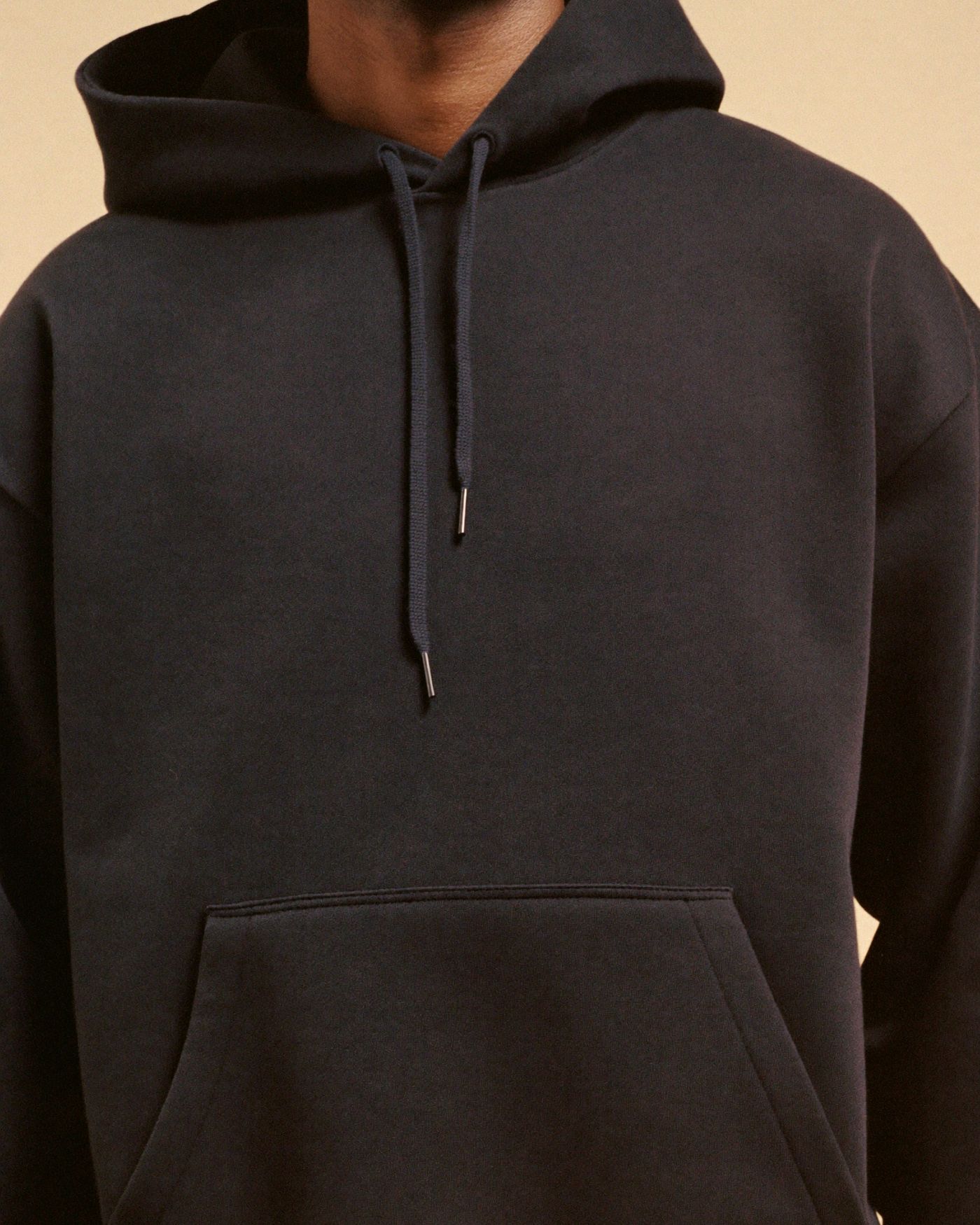 The Nimbus's dense brushed fabric and kangaroo pocket up close