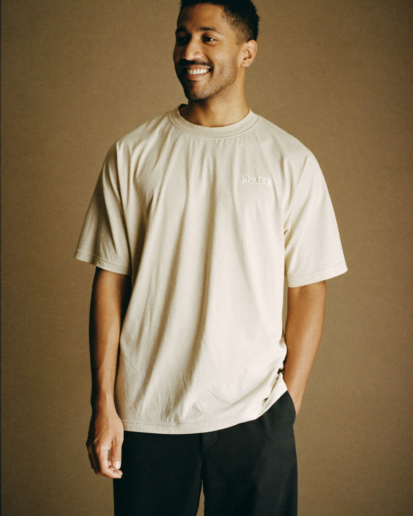 The Orion tee in bone, three-quarter view